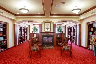 Cozy library area with comfortable seating and bookshelves