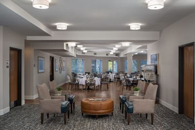 Bright common area with seating and dining setup