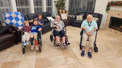 Residents and children in a cozy common area