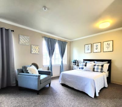 Cozy resident room with bed and seating area