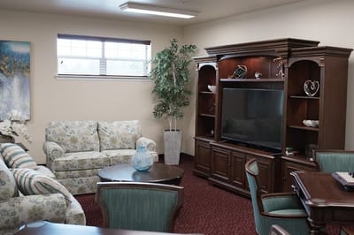 Comfortable common area with seating and a television