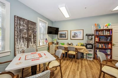 Bright activity room with tables and chairs