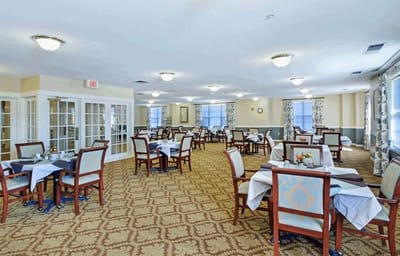 Dining area with tables set for residents