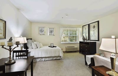 Bright, private resident room with light decor