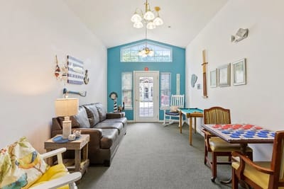 Common area with seating and games in a bright environment