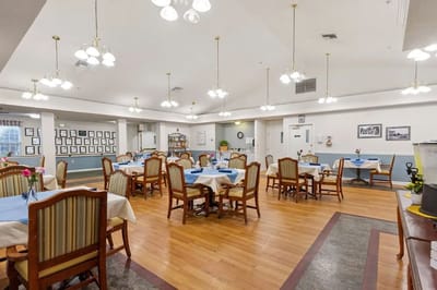 Dining room setup with tables and chairs