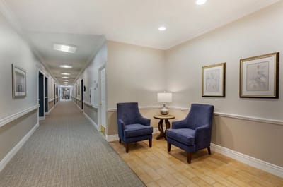 Bright corridor with chairs and framed art