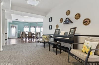Cozy common area with seating and piano