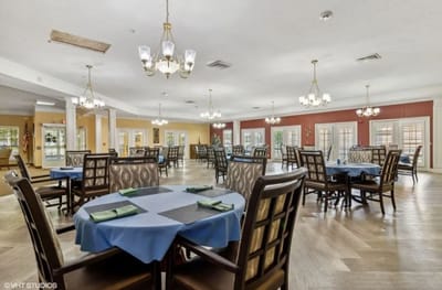 Bright dining room with tables set for meals