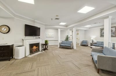 Interior common area with seating and a fireplace