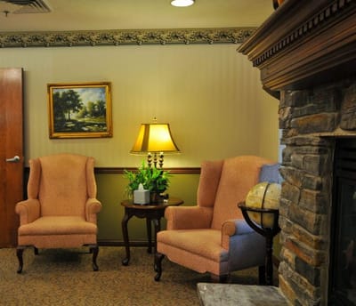 Cozy sitting area with armchairs and lamp
