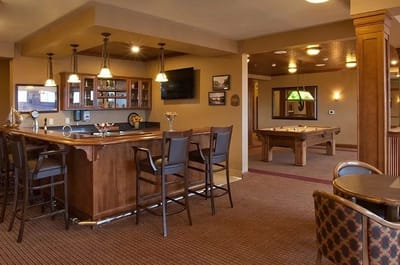 Interior common area with a bar and pool table