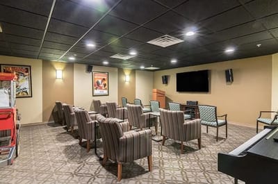 Interior common area with seating and a projector