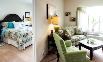 Cozy resident room with bedroom and sitting area
