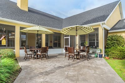 Outdoor patio area with seating and umbrellas