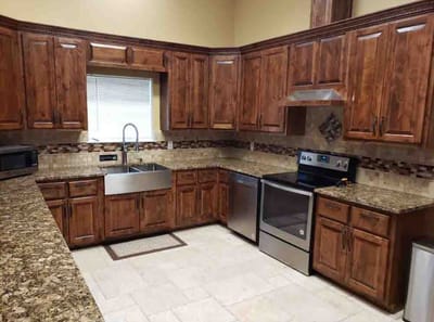 Modern kitchen interior with wooden cabinets and appliances