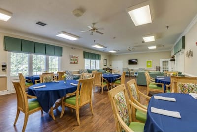 Bright dining room with tables set for meals