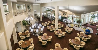 View of a spacious dining area with tables and chairs