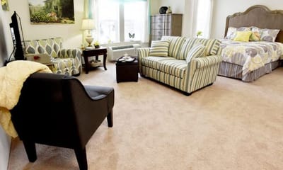 Interior view of a cozy resident room with furniture