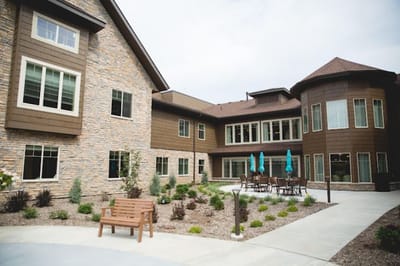 Exterior view of the assisted living facility with landscaped area