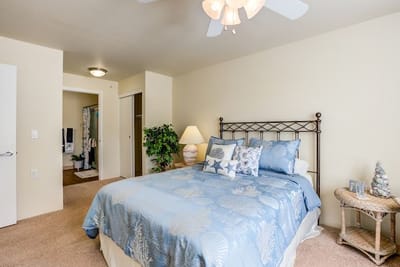 Brightly decorated private resident room with a bed