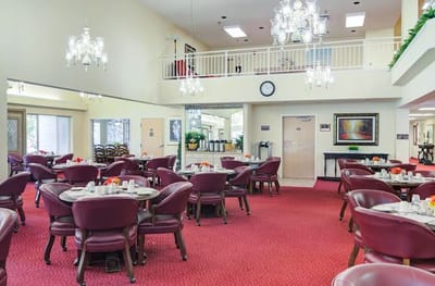 Bright dining room with tables set for a meal