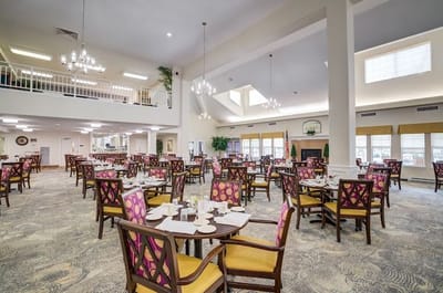 Bright dining room with tables set for meals