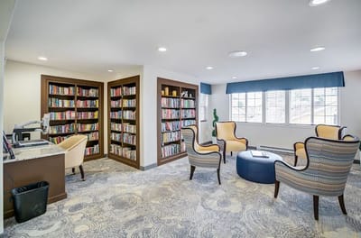 Cozy reading area with bookshelves and seating