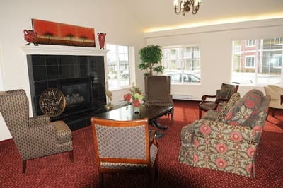 Common area with seating and fireplace