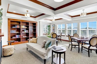 Bright common area with seating and bookshelves
