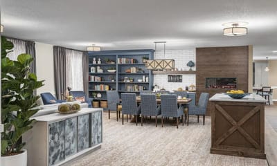 Bright common dining area with cozy seating and decor