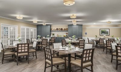Dining room setup with tables and chairs