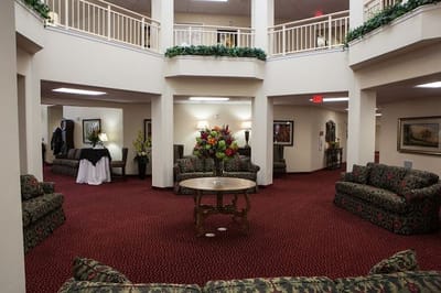 Interior common area with seating and floral arrangements