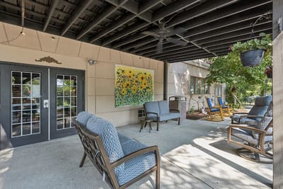 Outdoor seating area with colorful mural