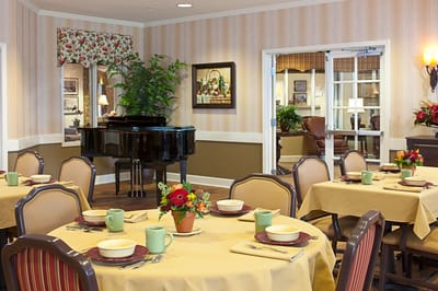 Dining area with tables set for residents