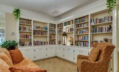Cozy reading nook with bookshelves and seating