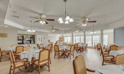Inside view of a spacious dining room with tables