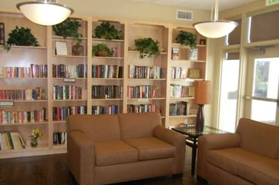 Common area with bookshelves and seating
