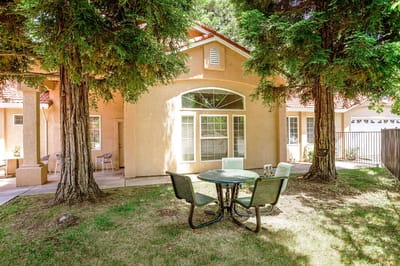 Outdoor seating area with a table and chairs