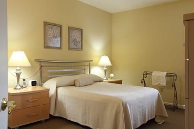 Well-furnished private resident room with soft lighting