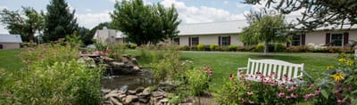Beautiful outdoor garden area with seating and flowerbeds