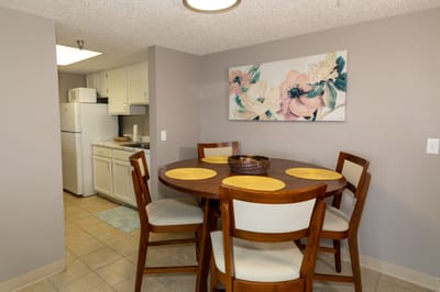 Cozy dining area with floral artwork