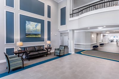 Bright and modern lobby area with seating and artwork