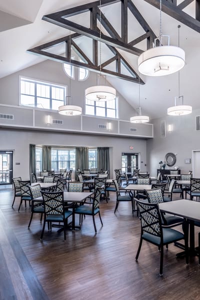 Bright and spacious dining room with tables