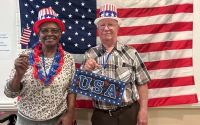 Residents celebrating with patriotic decor indoors