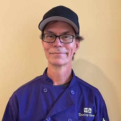 Male staff member in chef uniform at Dunlop House