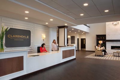 Bright reception area with staff assisting residents