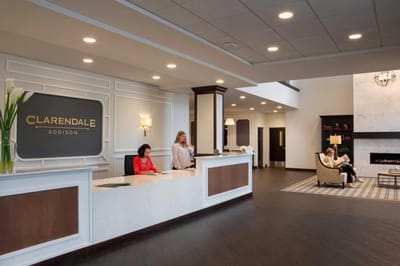 Reception area with staff attending to guests