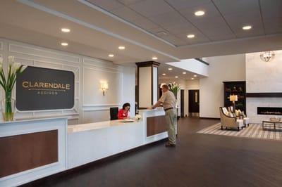 Reception area with staff interacting with a resident