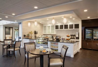 Bright dining area with food display and seating